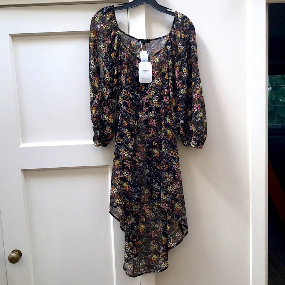 Millau black floral dress with tags.